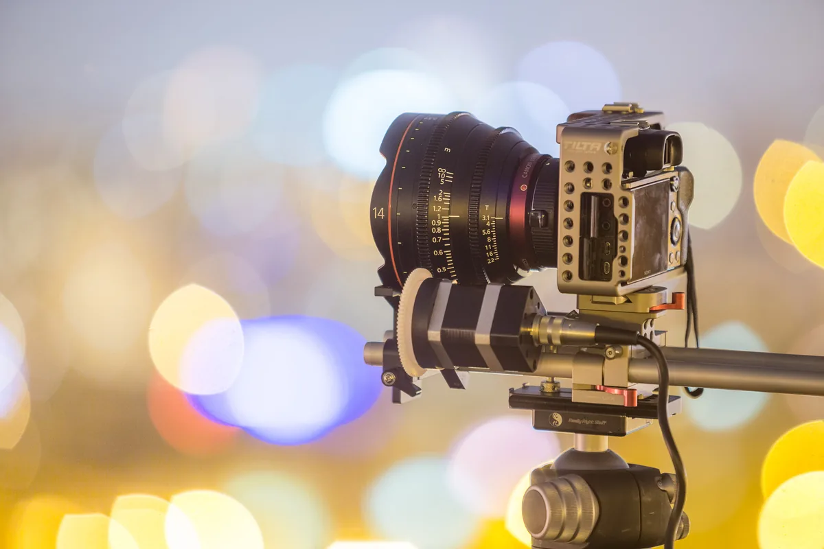 Canon 14mm cinema lens on a Sony camera, with visible focus scale and a motorized focus gear