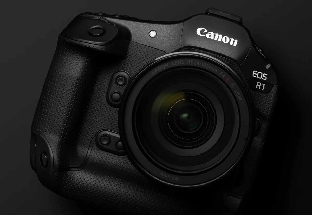 Canon EOS R1 photographed in a dark studio with an RF lens attached