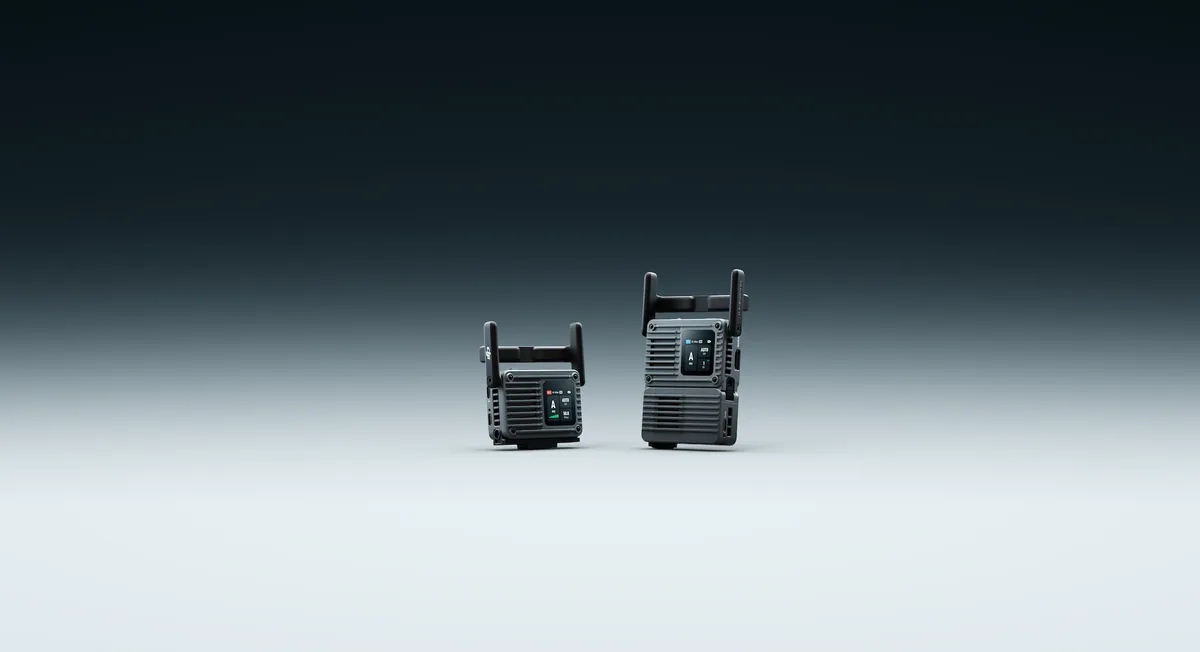 Two DJI SDR Transmission 2 configurations standing against a blue-gray background.