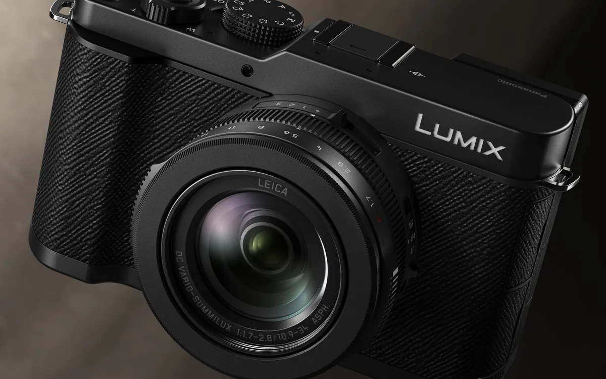 Close-up of the black LUMIX L10 showing its fixed Leica zoom, aperture ring and top controls.