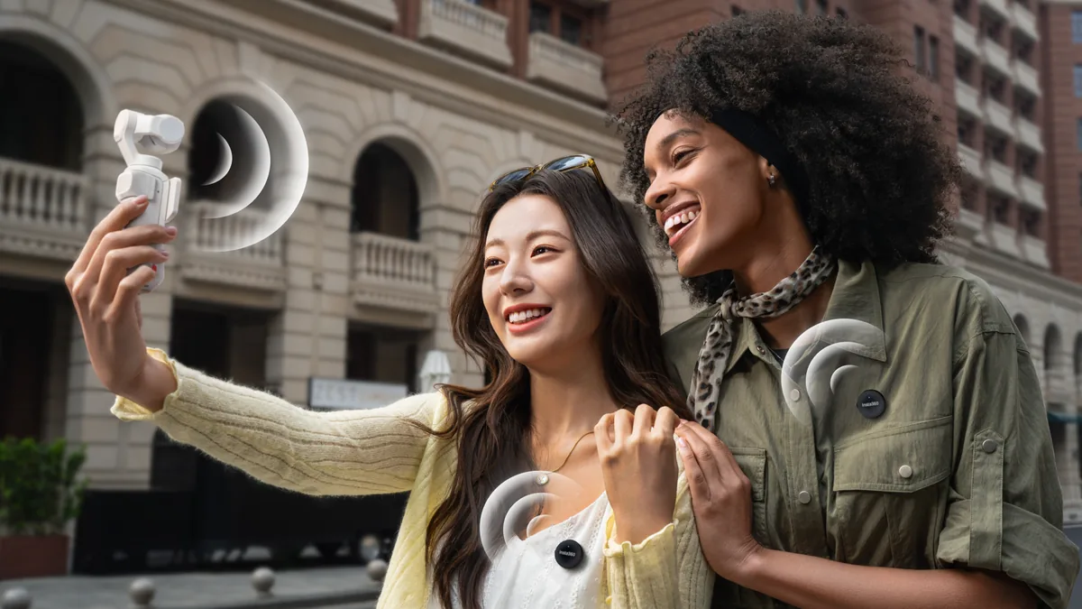 Two women recording with a white Insta360 Luna Pro and clip-on microphones in an official press illustration