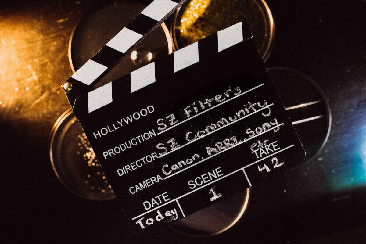 SZ Filters clapperboard with circular filters arranged behind it in warm and blue light.