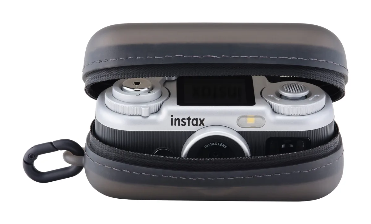 Fujifilm instax Pal 2 in a partly opened protective case, with its top screen and controls visible