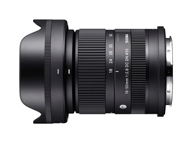 Side view of the earlier Sigma 18–50mm F2.8 DC DN lens with hood and focal-length markings.