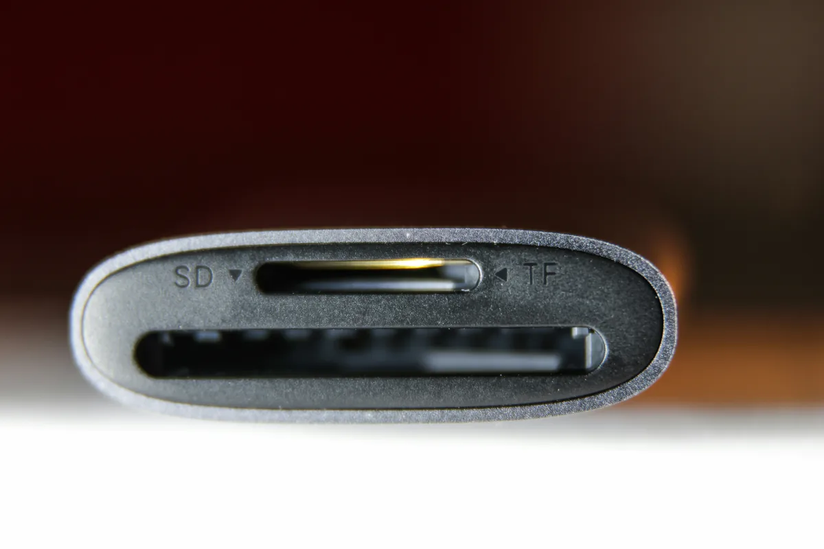Close-up of a gray card reader with SD and TF slots.