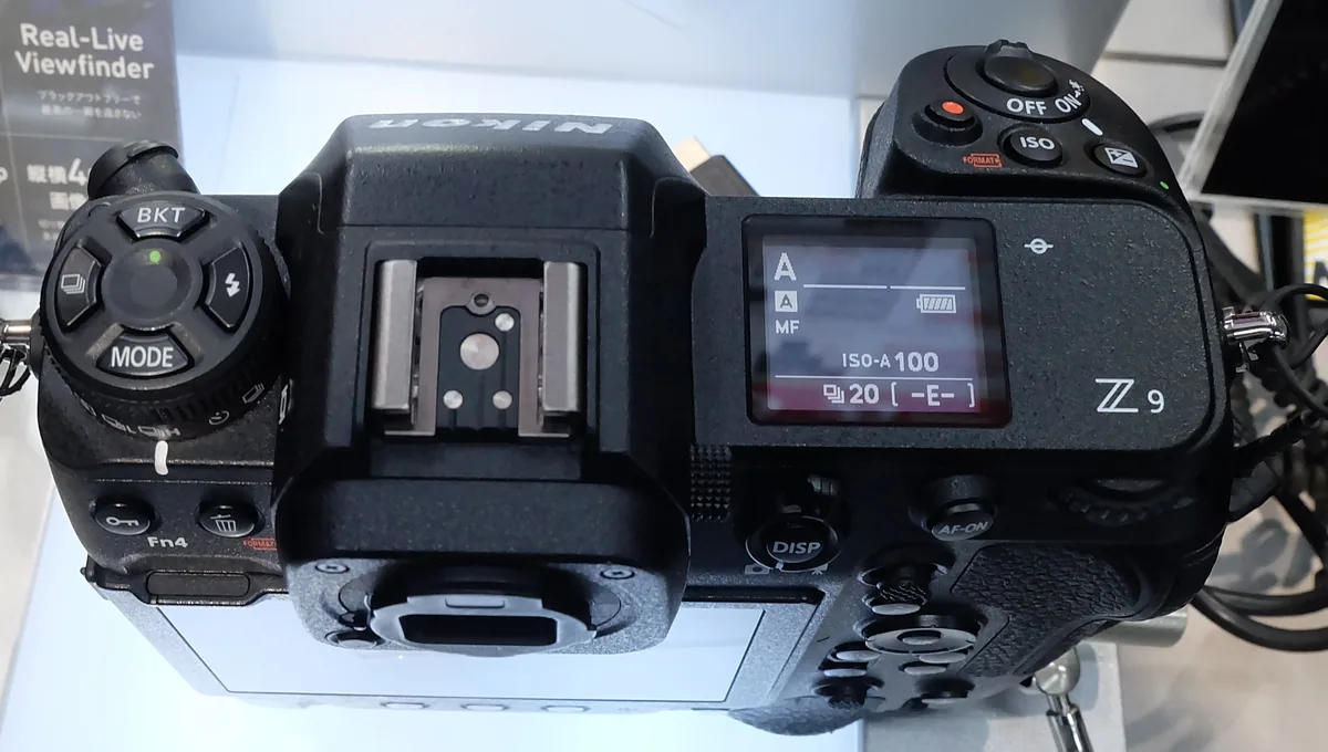 Top view of a Nikon Z9 showing its mode controls, hot shoe and status display.